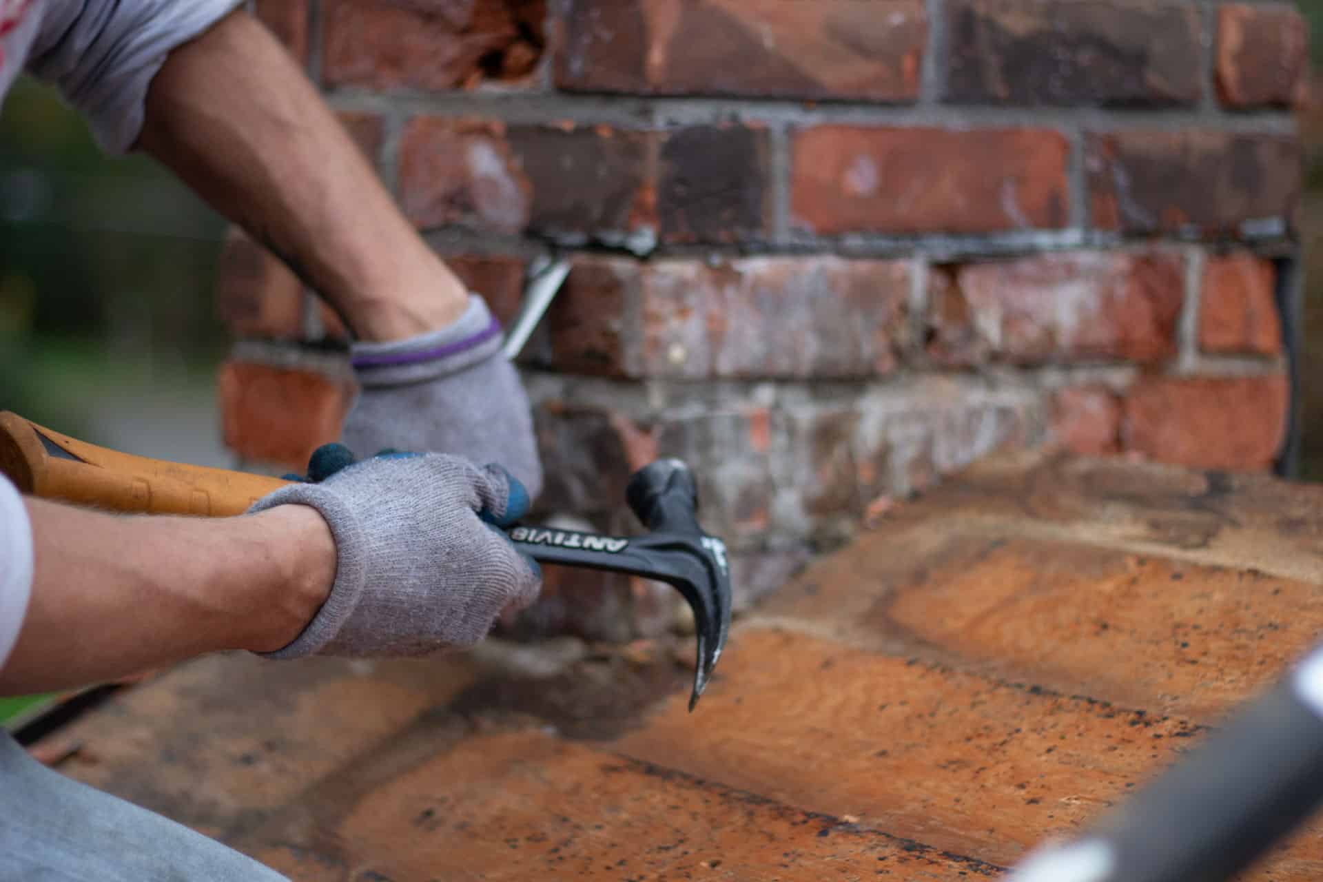 BCM Roofer repairing a roof and chimney in Independence Michigan