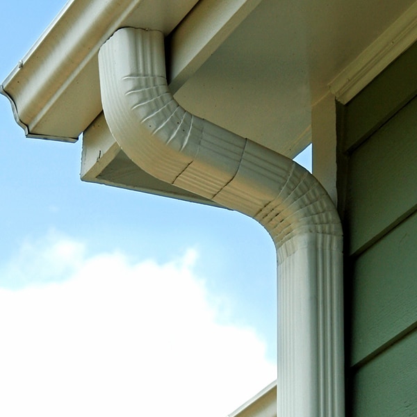 BCM Roofing installs new downspouts on a home in Armada Michigan