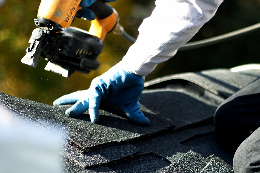 BCM Roofing repairing a roof from storm damage in Novi Michigan