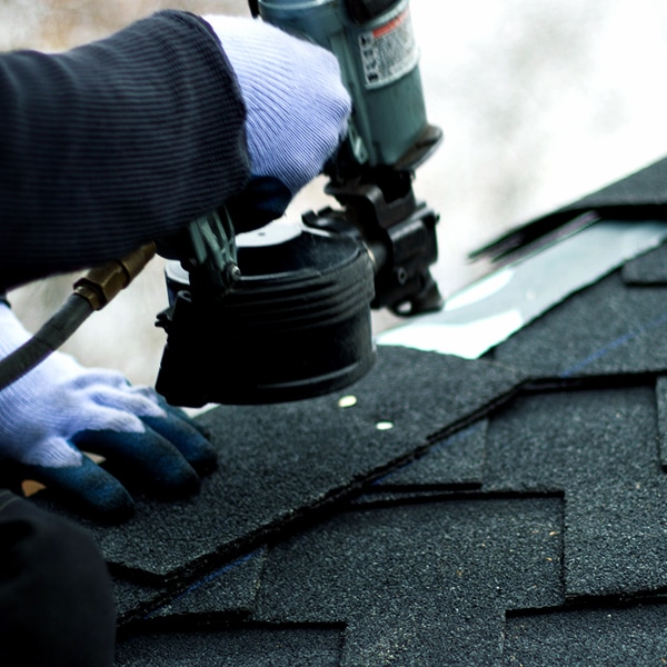 BCM Roofing repairing ridge caps from storm damage in Northville Michigan