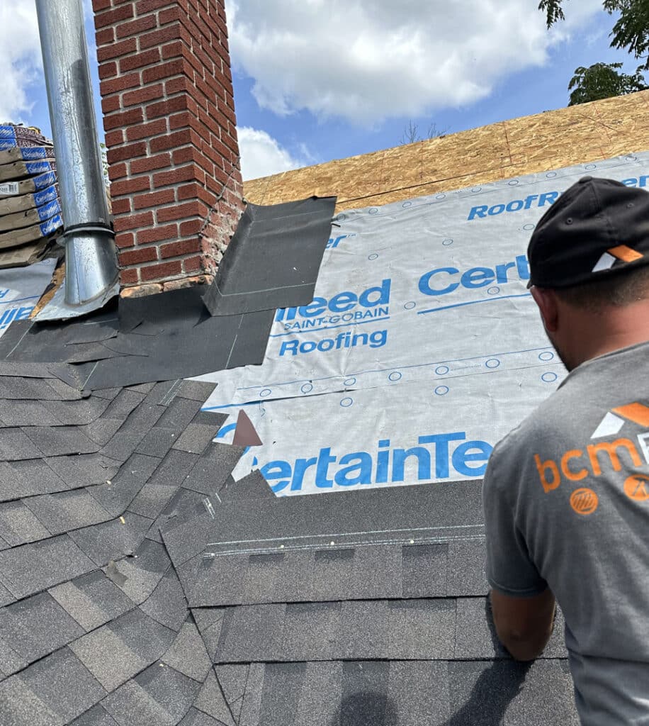 Revealing the roof deck, underlayment and new shingles