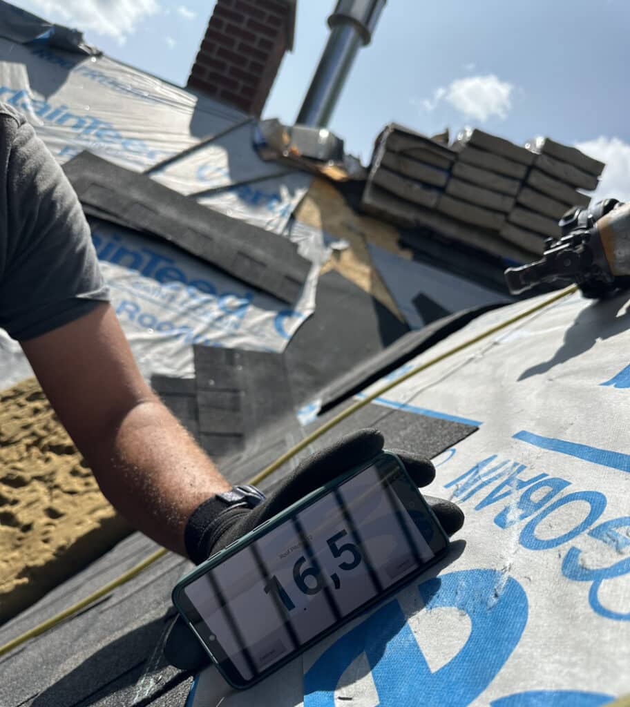 BCM Roofing installing new vents during roof installation in Bloomfield Township