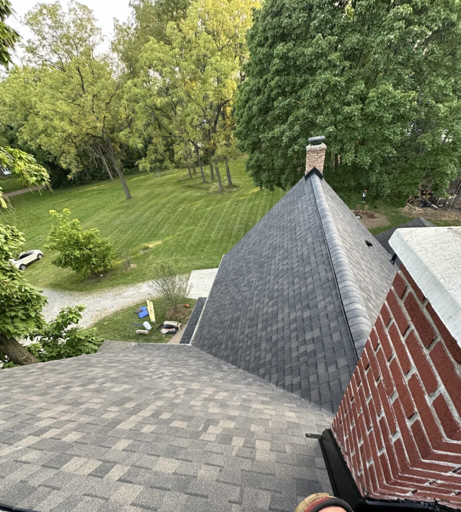 Our crew spent 2 days installing the large roof on this Bloomfield Township home, including a super-steep 16:5 roof pitch, not an easy feat! 