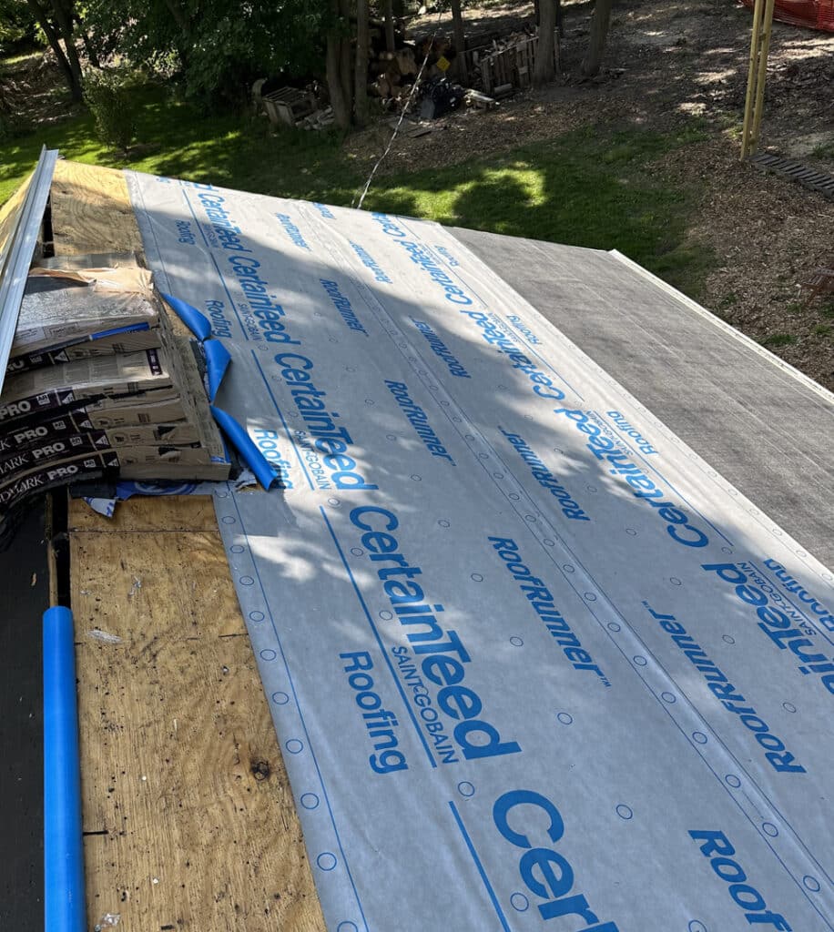 Given its age and condition, it was the perfect time to replace it with a fresh layer of boards, underlayment and shingles.