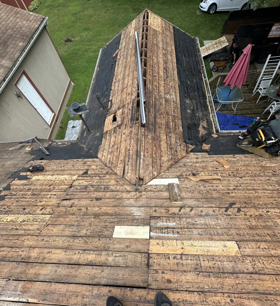 Roof Repair & Installation in Waterford Township with new Skylight 21 exposed wood roof decking after shingle tear off prepped for repair and replacement in waterford township mi