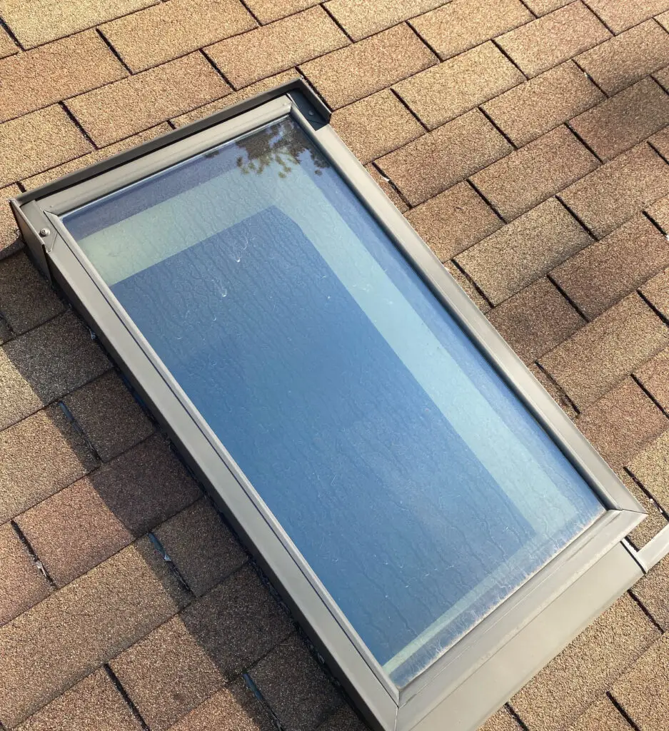 Roof Repair & Installation in Waterford Township with new Skylight 17 new installed skylight window with flashing detail on residential roof in waterford township mi