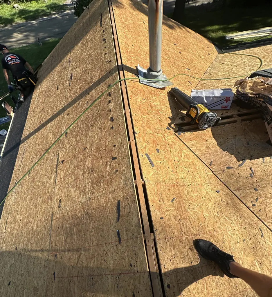 Roof Repair & Installation in Waterford Township with new Skylight 29 roof decking exposed and prepared for new underlayment installation in waterford township mi