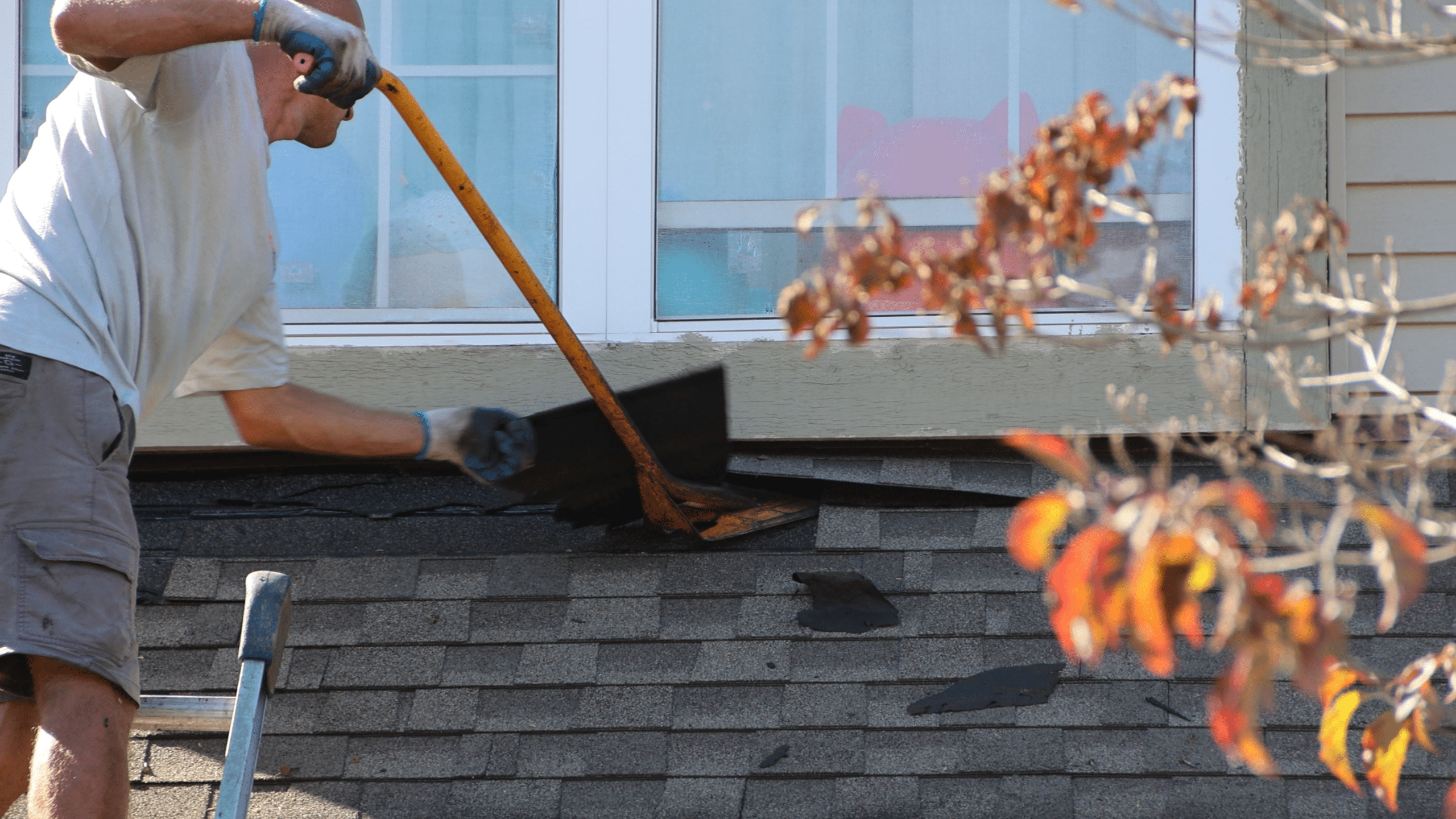 BCM Crew removing shingles on a home roof preparing for a new roof to be installed.