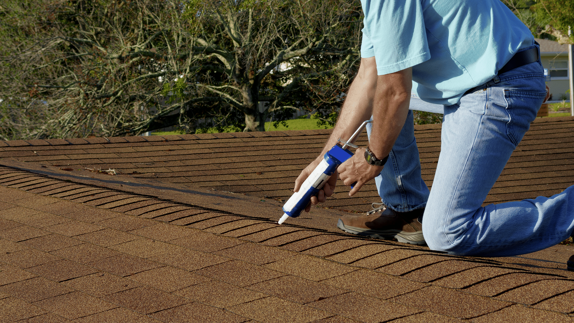 Homeowner patching home roof