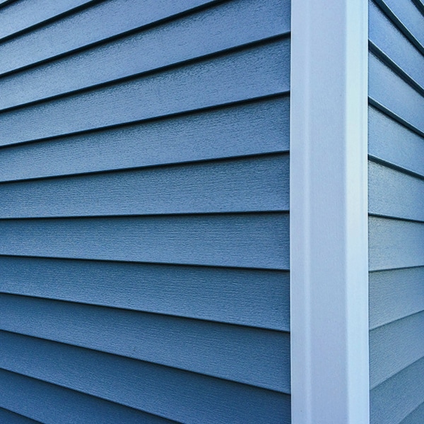 a close up of a blue siding