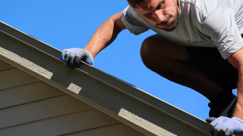BCM roofing expert conducting roof inspection