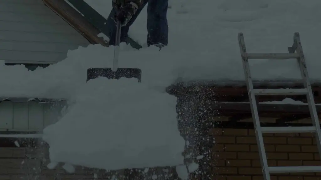 BCM Roofing roof snow removal process at residential home.