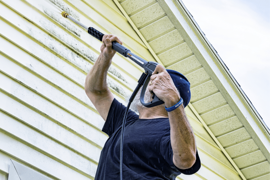 pressure washing siding as part of home maintenance checklist