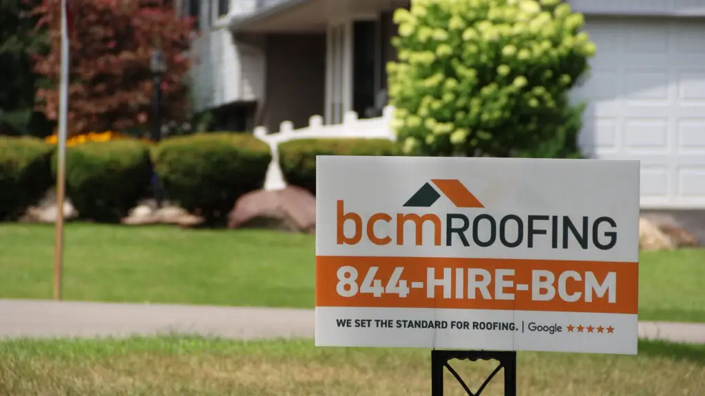 BCM Roofing contact information yard sign in Flint, MI.